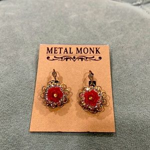 Metal Monk Floral earrings.